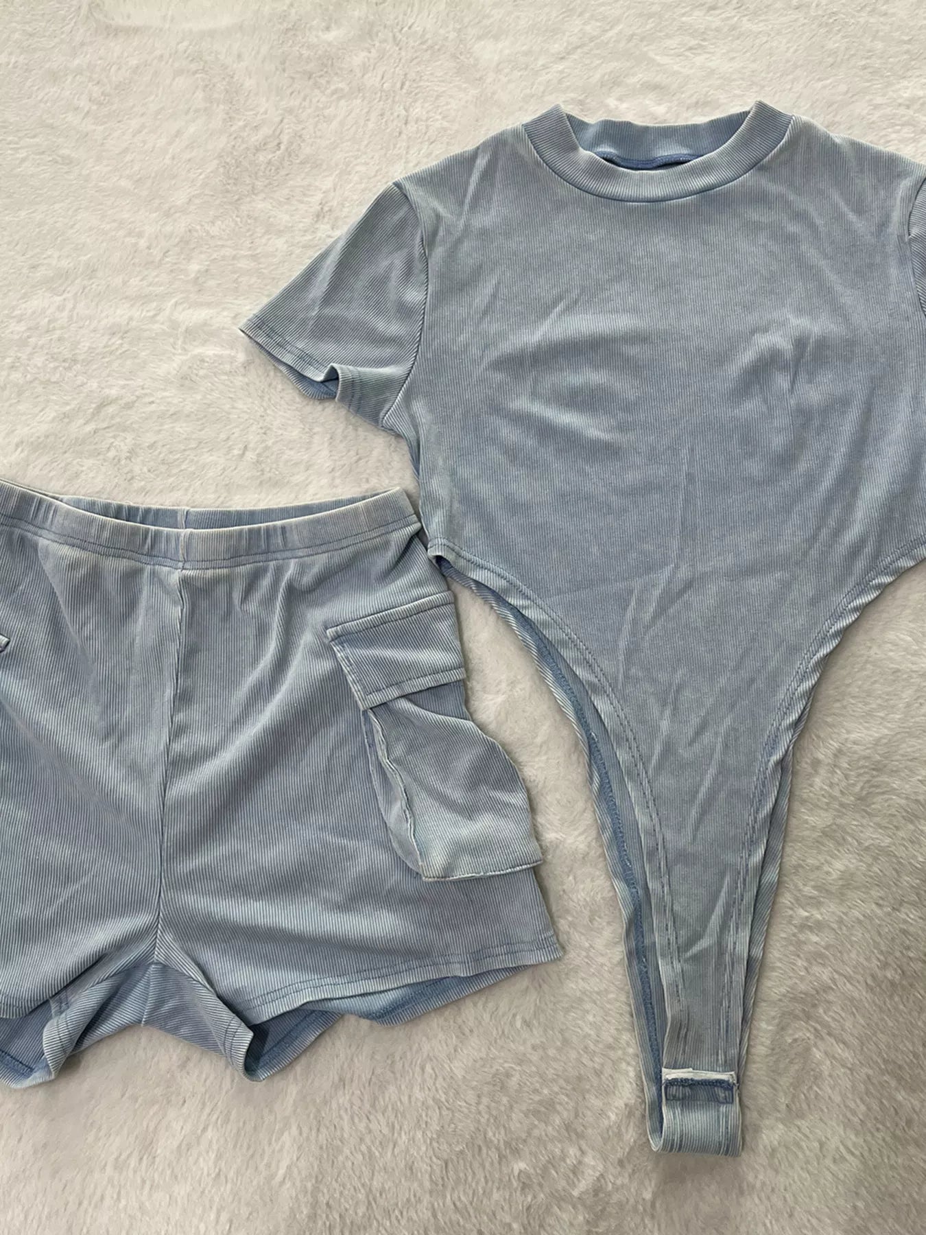 Ribbed knit bodysuit and shorts set by Shopimist, featuring a fitted design with ribbed texture and stylish matching shorts.