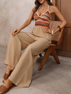 Elegant women's halter neck wide-leg jumpsuit by Trendsi, featuring a chic design perfect for evening wear.
