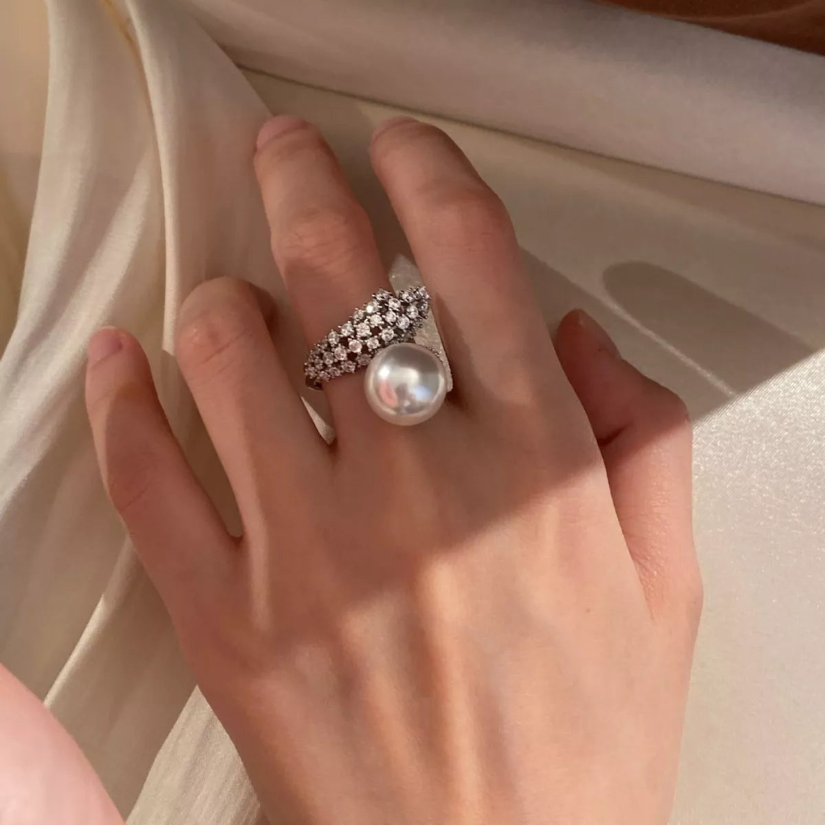 925 Sterling Silver Pearl Bypass Ring featuring a sleek design and lustrous pearls, perfect for elegant jewelry collection.