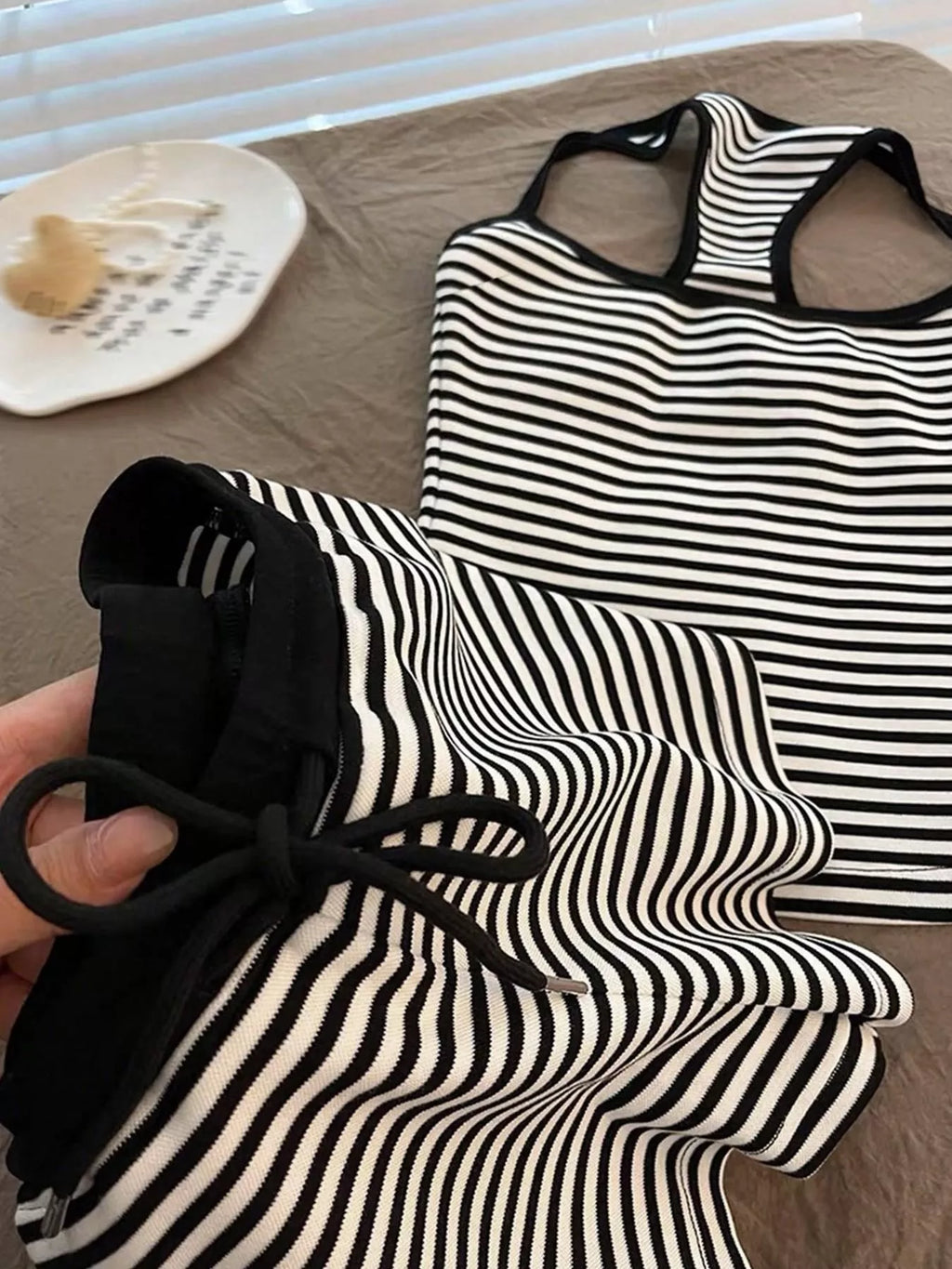 Striped tank top and shorts set by Trendsi, featuring a casual summer look with lightweight fabric and vibrant stripe pattern.