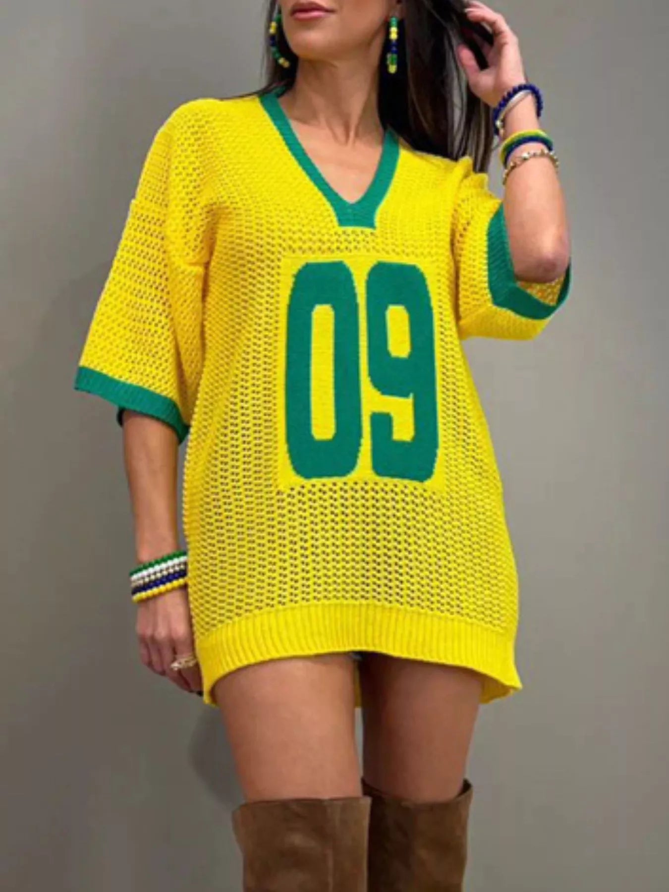 Lightweight women's oversized V-neck openwork sweater by Trendsi, featuring a knit pullover with a relaxed fit and stylish openwork details.