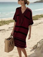 Plus size women's striped half-sleeve midi dress by Plush Fashion Hub, casual chic everyday wear, featuring a stylish mid-length design.