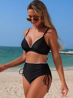 High-waisted bikini set with scalloped trim from Trendsi, stylish two-piece swimwear featuring a flattering fit and vibrant color.