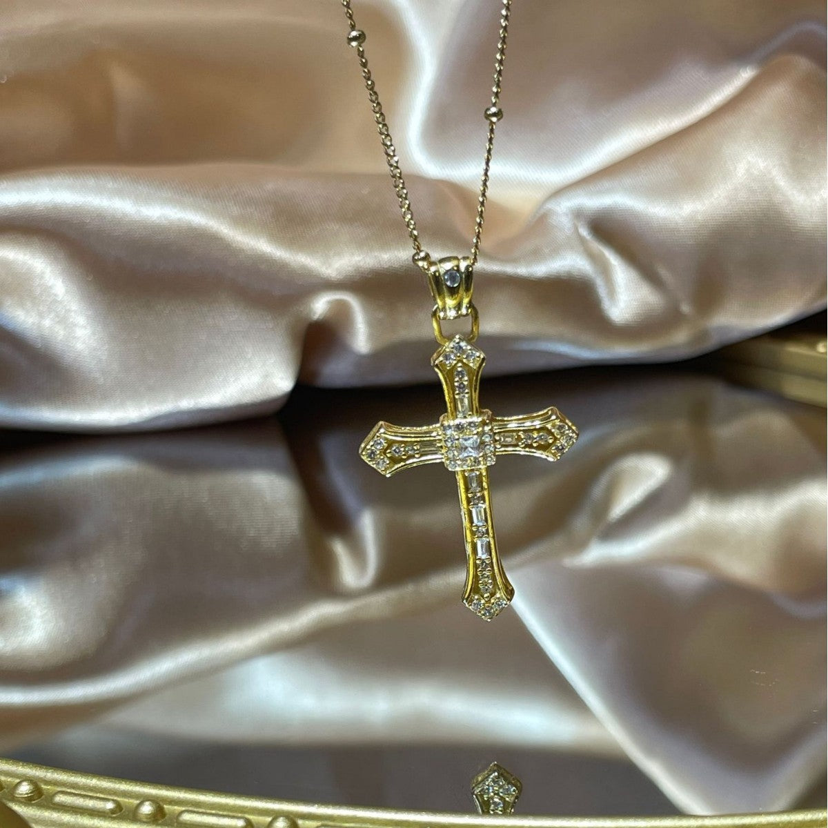 18K gold-plated cross pendant necklace with detailed design, showcasing a stylish and elegant jewelry piece.