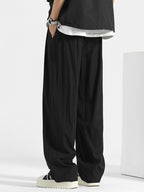 Men's loose fit casual pants with drawstring waist by Trendsi, relaxed fit trousers suitable for everyday comfort.