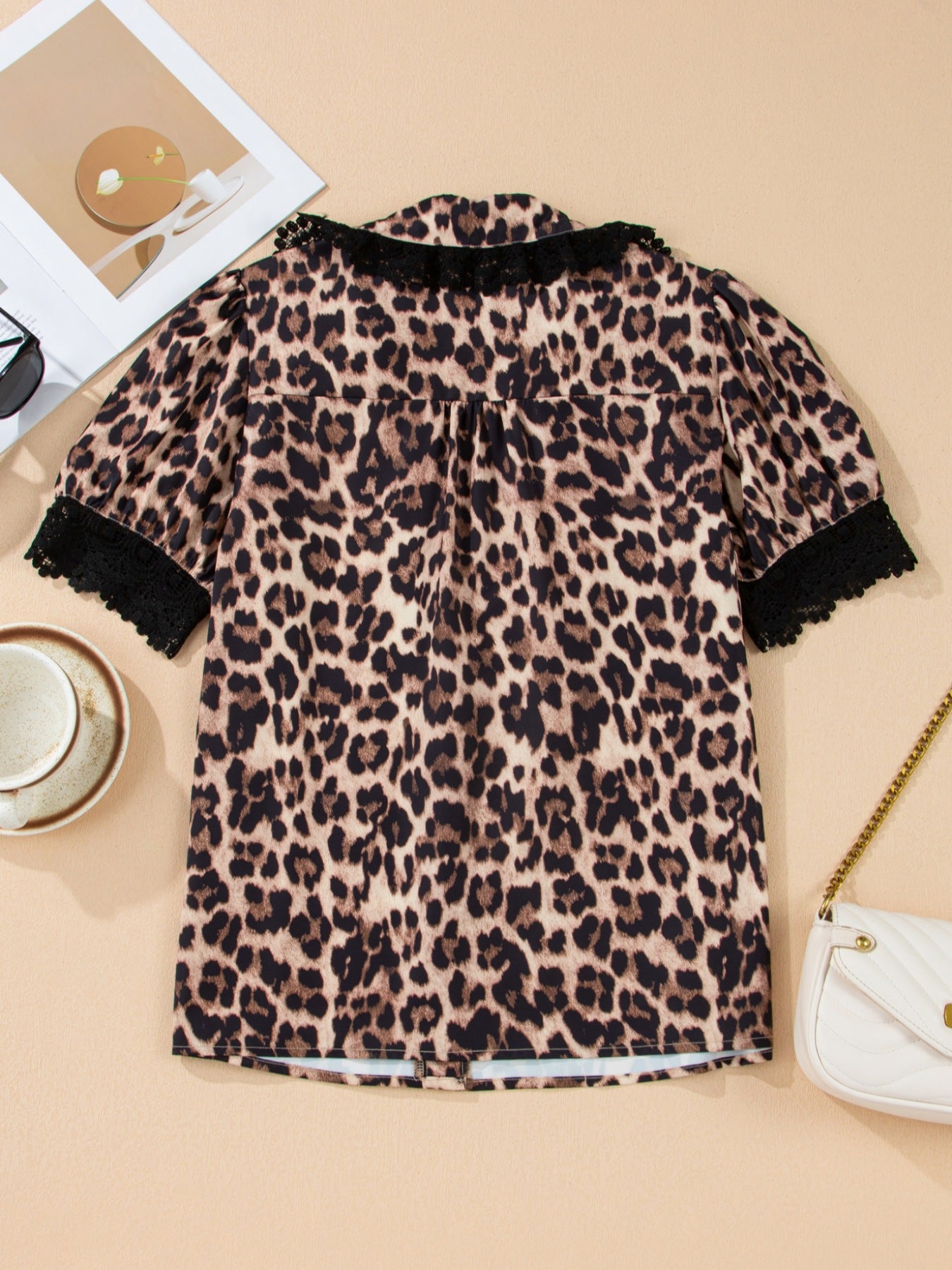 Leopard print short sleeve blouse with lace trim and button front from Plush Fashion Hub, stylish and lightweight women's top.