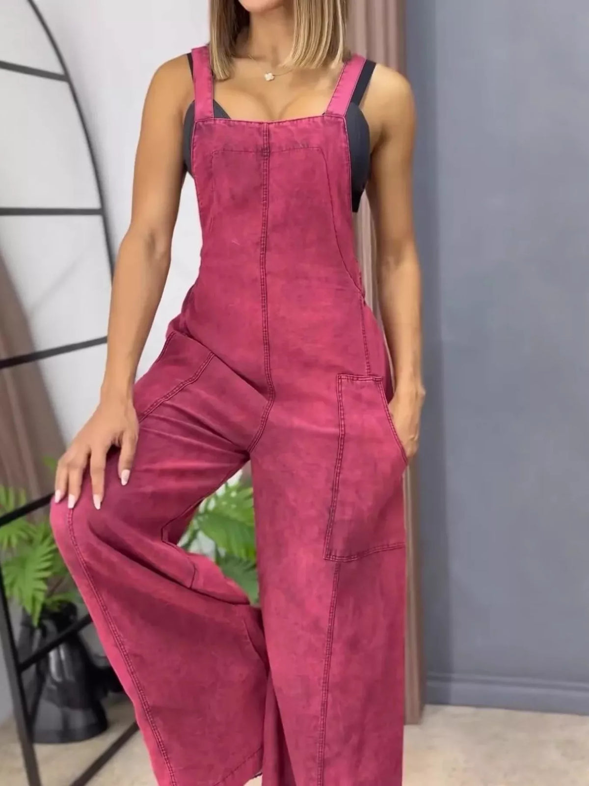 Blue wide-leg denim overalls by Plush Fashion Hub, full-length one-piece jumpsuit with adjustable straps and front pockets.
