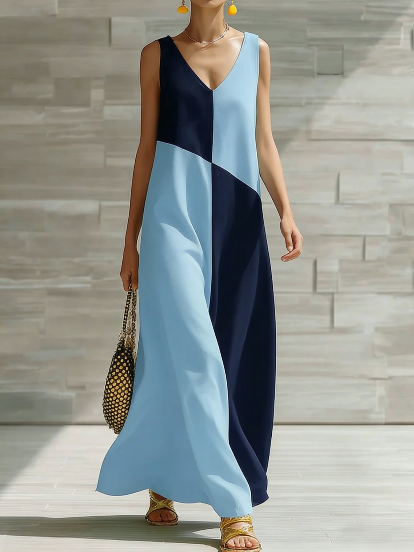 Women's chic color block sleeveless maxi dress from Trendsi, lightweight summer dress with vibrant color blocking and flowing fabric.
