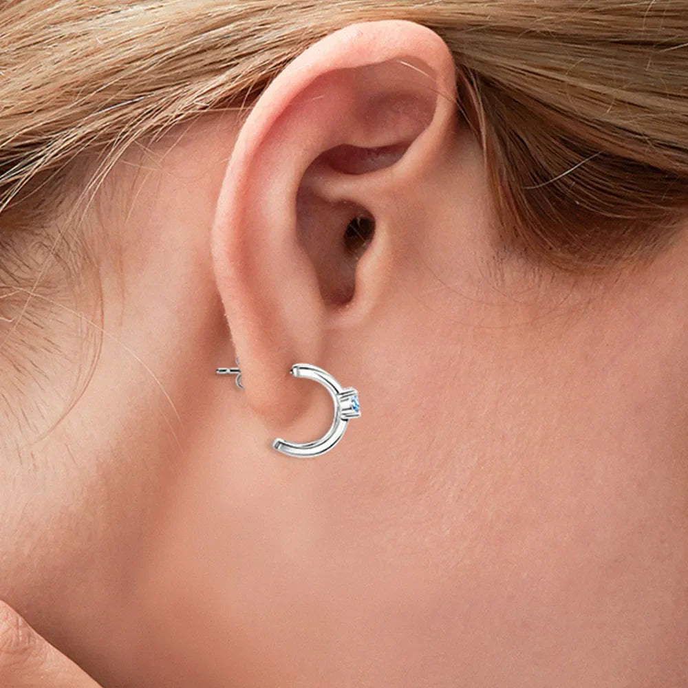 Sterling silver moissanite earrings with sparkling gemstone accents, elegant jewelry for fashion and special occasions.