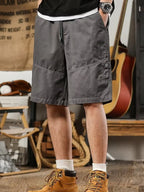 Men's plus size casual shorts with drawstring waist, deep pockets, relaxed fit, by Trendsi, suitable for comfortable everyday wear.