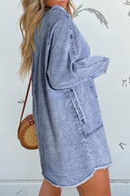 VYSN raw hem button-down long sleeve denim dress hanging on a mannequin, showcasing casual fashion and classic denim style.