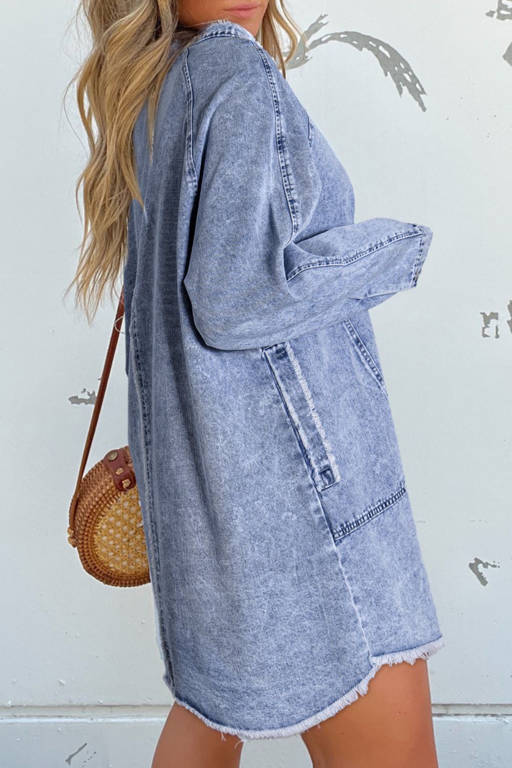 VYSN raw hem button-down long sleeve denim dress hanging on a mannequin, showcasing casual fashion and classic denim style.
