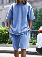 Men's relaxed fit T-shirt and shorts set in plus size, casual men's tops by Trendsi, with a comfortable, laid-back style.
