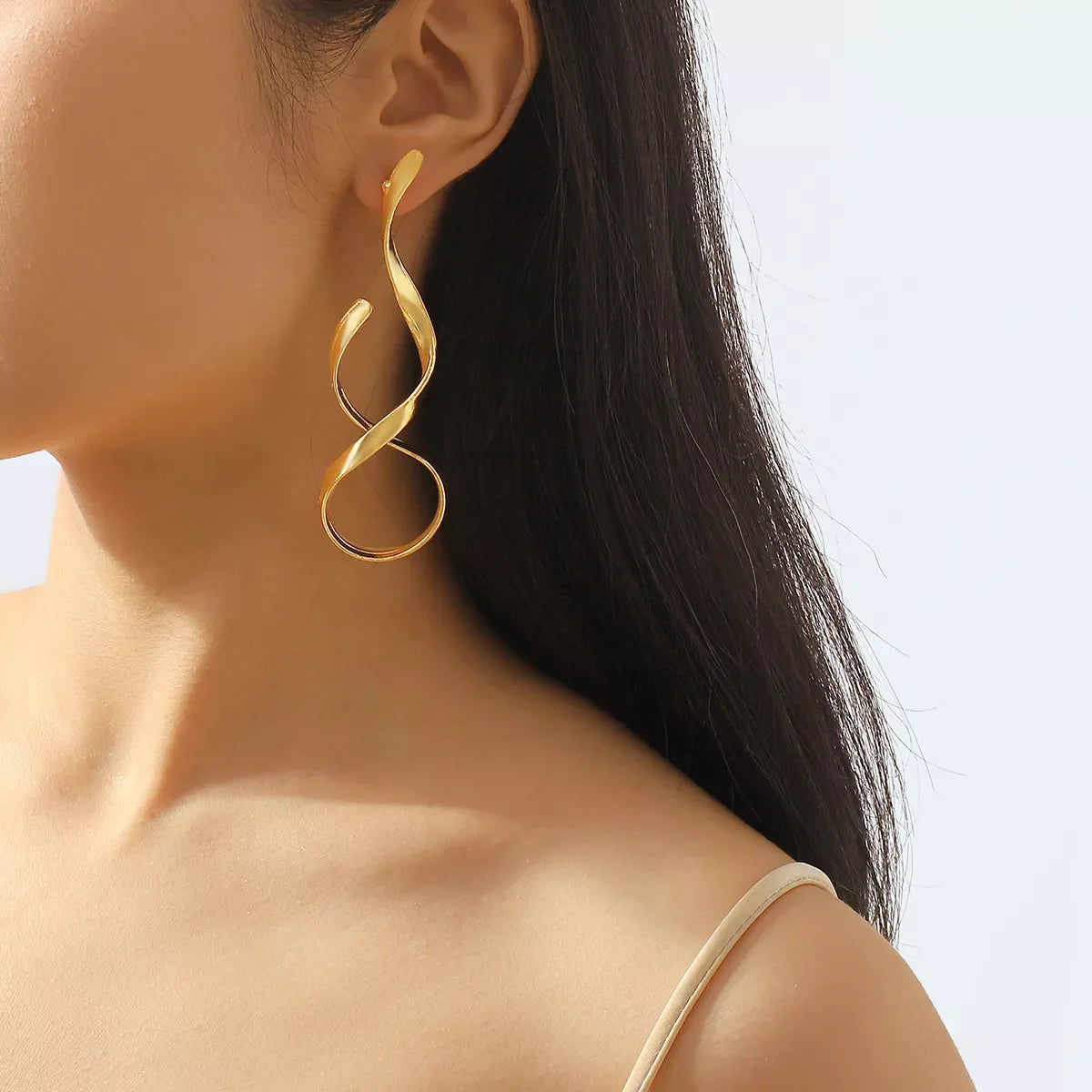 Plush Fashion Hub alloy spiral drop earrings featuring elegant, coiled design with a shiny metallic finish.
