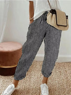 Striped cropped pants by Shopimist featuring a high-waisted fit and bold horizontal stripe pattern, shown on a model.