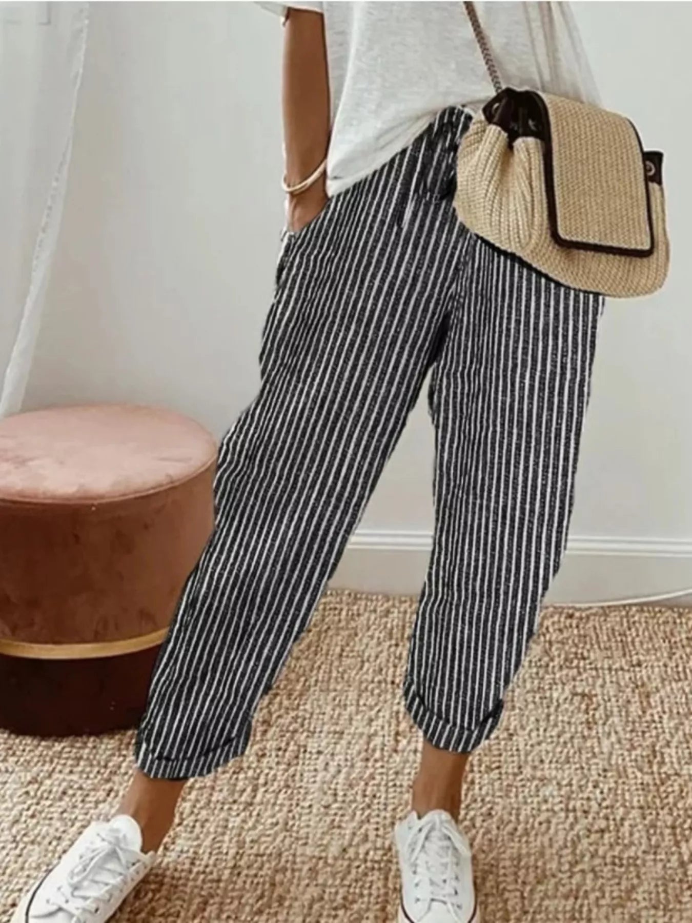 Striped cropped pants by Shopimist featuring a high-waisted fit and bold horizontal stripe pattern, shown on a model.