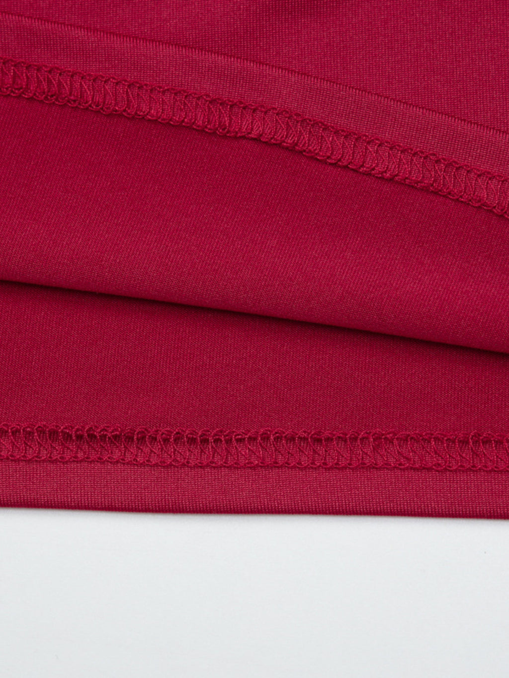 Women's one-shoulder fitted T-shirt with button accents by Trendsi, showcasing a stylish design and casual fit.