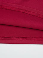 Women's one-shoulder fitted T-shirt with button accents by Trendsi, showcasing a stylish design and casual fit.