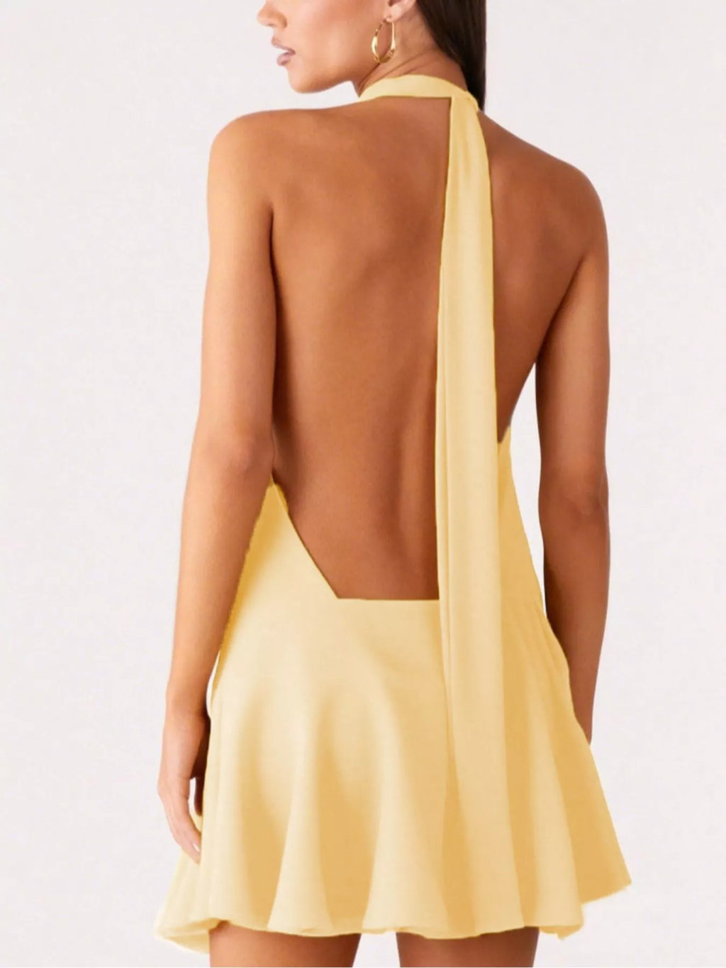 Backless halter neck gathered waist dress by Plush Fashion Hub, showcasing a stylish dress with a fitted waist and open back.
