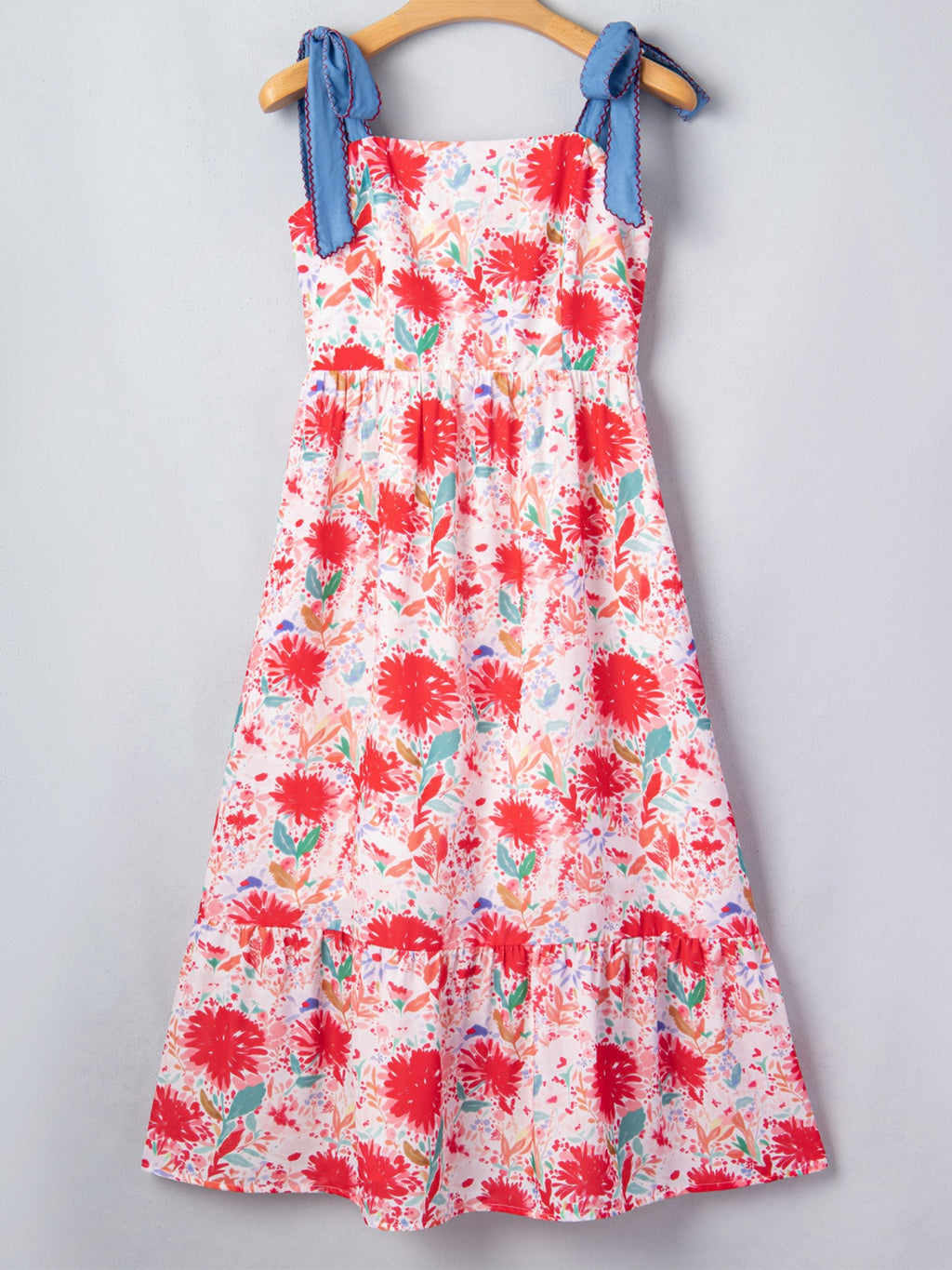 Floral print tie-shoulder midi dress with pockets, lightweight summer dress by Trendsi, shown on a model in a bright outdoor setting.