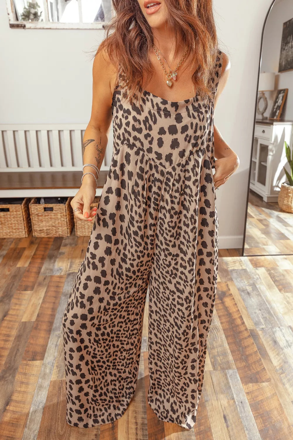 Leopard print square neck pleated wide-leg jumpsuit from Plush Fashion Hub, featuring a stylish design and flowing fabric.