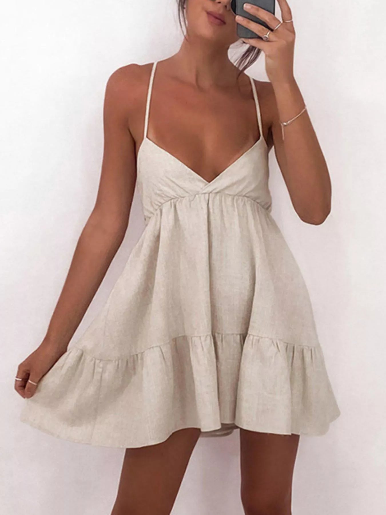 Backless spaghetti strap mini dress by Plush Fashion Hub featuring a fitted silhouette and stylish open back design.