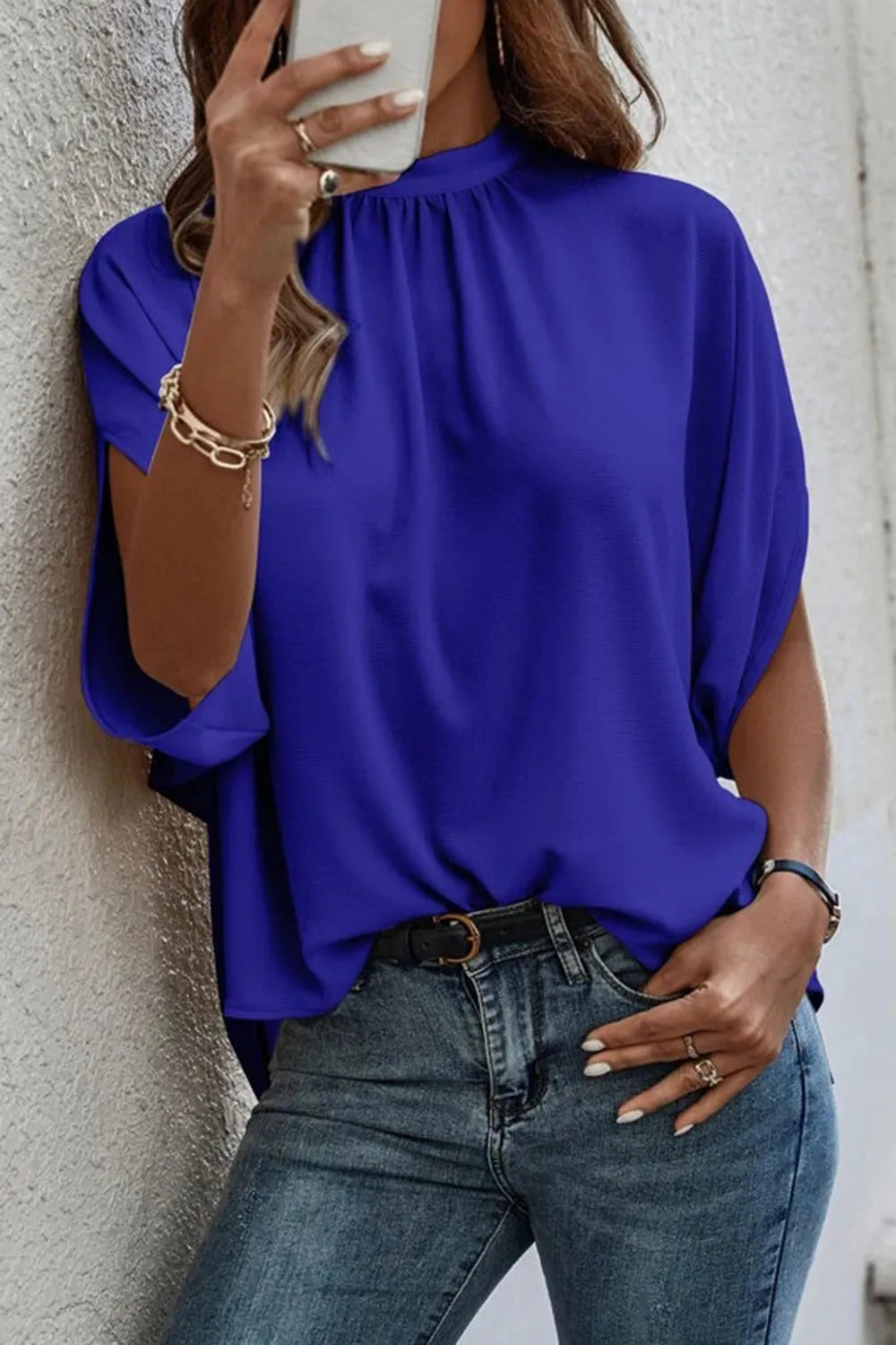 Elegant Plush Fashion Hub tie-back half-sleeve blouse with side slit, featuring a stylish and comfortable top design.