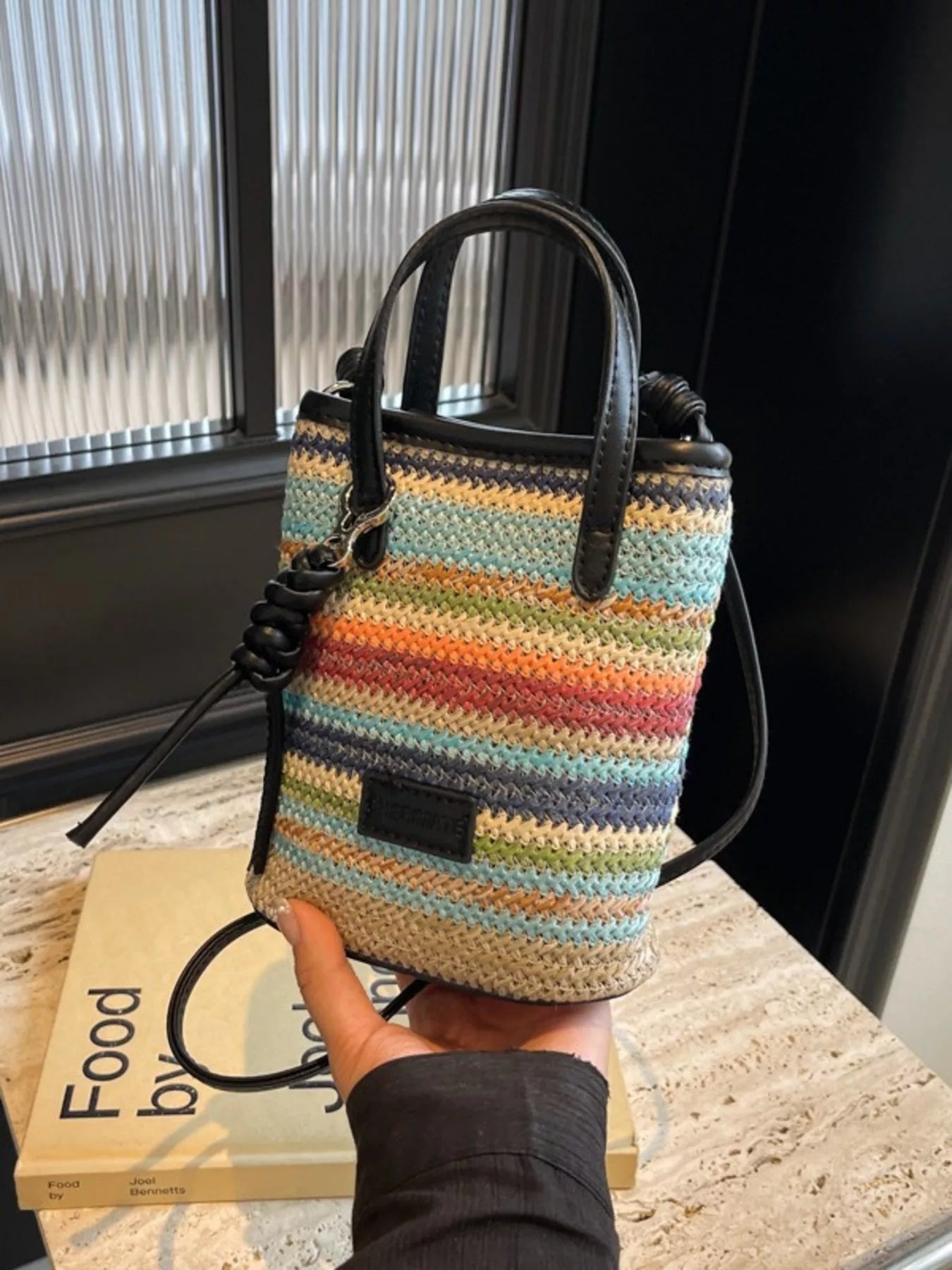 Striped woven mini crossbody bag with adjustable strap, trendy bag by Trendsi featuring colorful striped pattern and compact design.