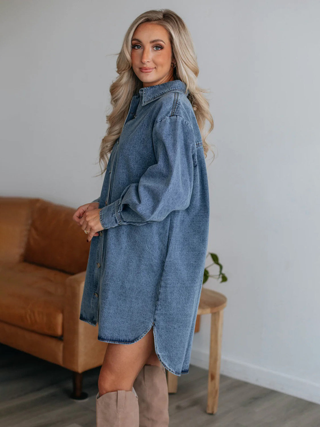 Plush Fashion Hub denim long sleeve collared button-up dress hanging on a wooden hanger, showcasing casual fashion style.