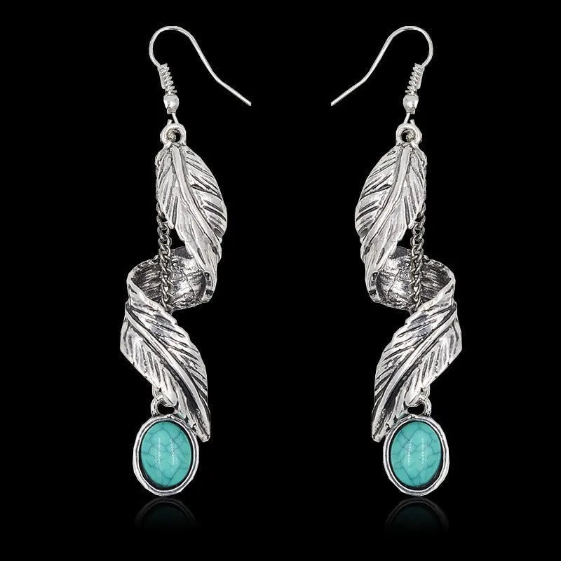 Turquoise alloy leaf earrings by Plush Fashion Hub featuring intricate leaf-shaped design for stylish accessory.
