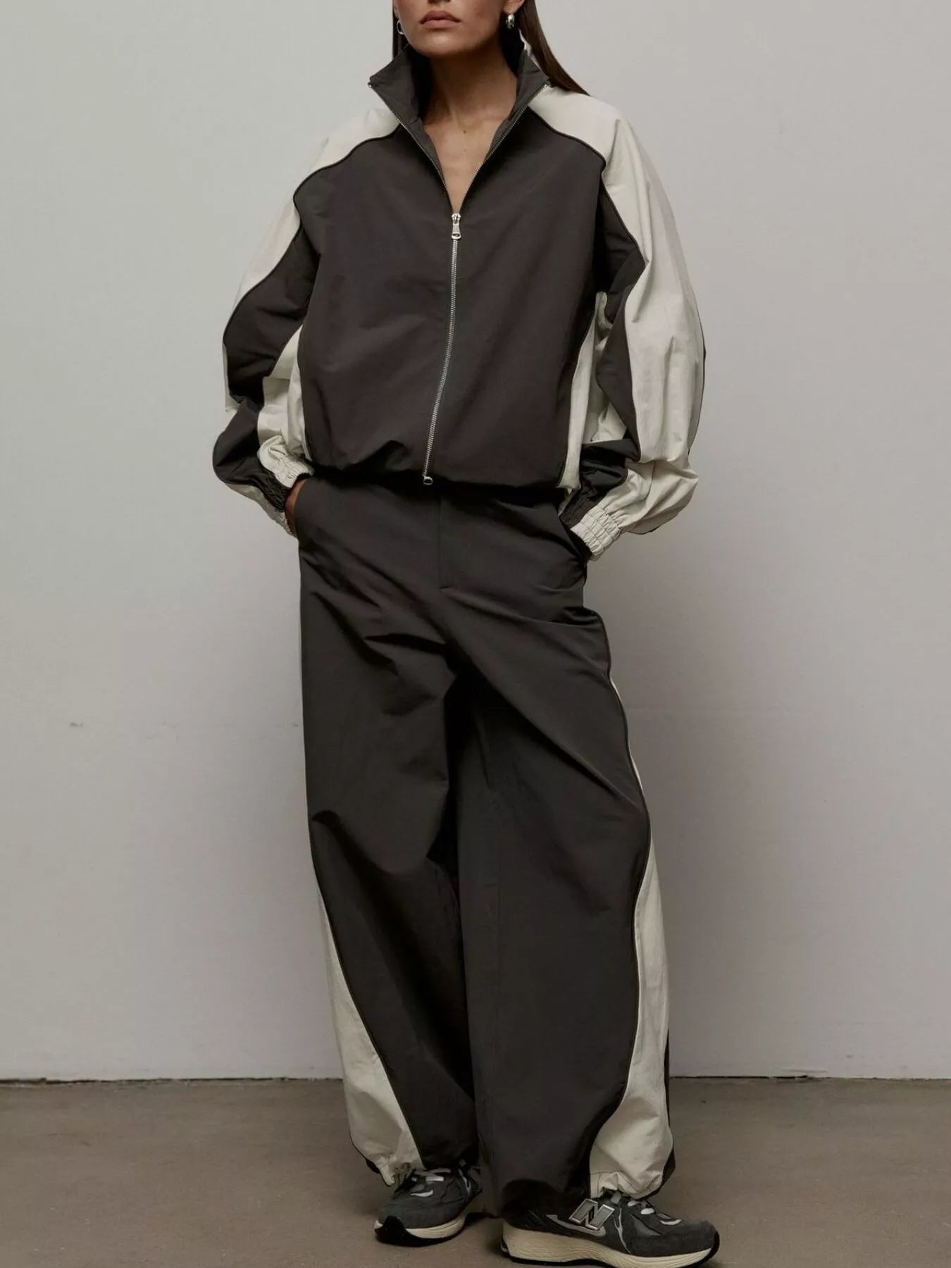 Color block zip-up outerwear and pants set from Trendsi, featuring vibrant color blocks and a sporty, casual style.