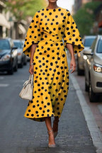 Flowy maxi dress with geometric print and batwing sleeves from Plush Fashion Hub, casualwear style in XS to XXXL sizes.