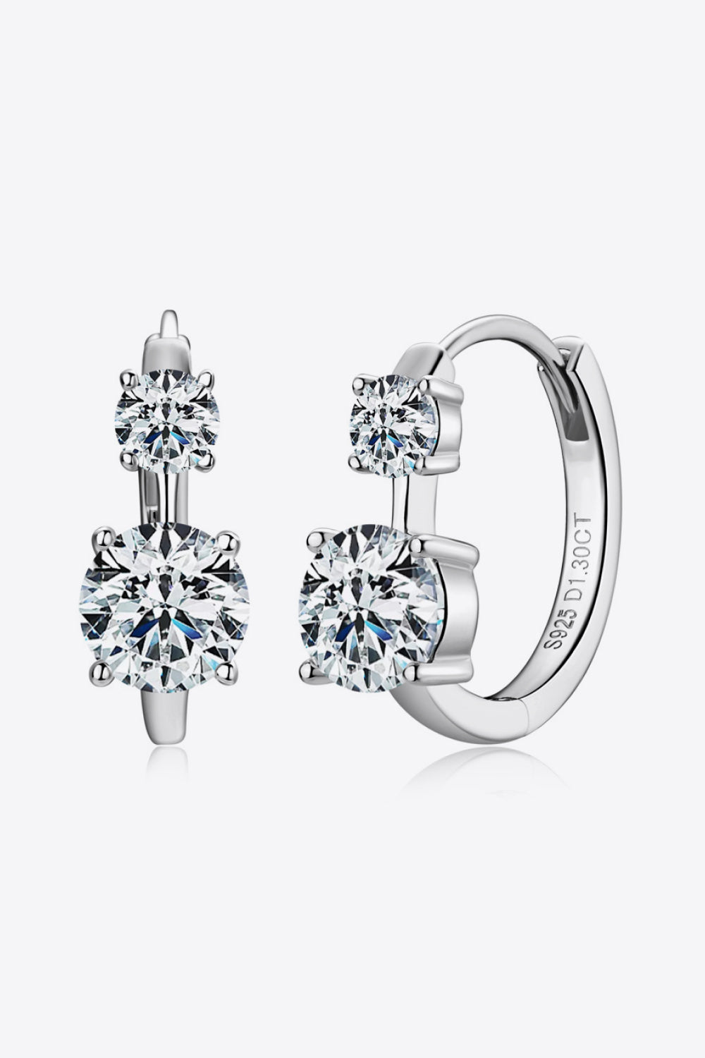 Sterling silver earrings featuring 1.3 carat moissanite gemstones, elegant jewelry piece with a polished finish.