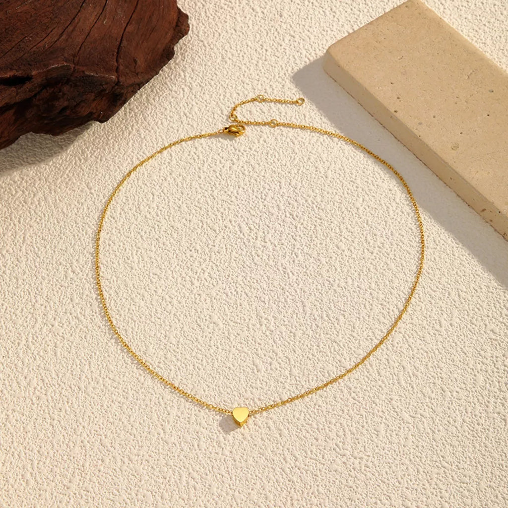 18K gold-plated heart pendant necklace with a delicate chain, showcasing a shiny, elegant jewelry piece from Shopimist.