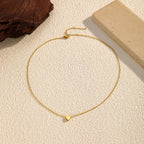 18K gold-plated heart pendant necklace with a delicate chain, showcasing a shiny, elegant jewelry piece from Shopimist.