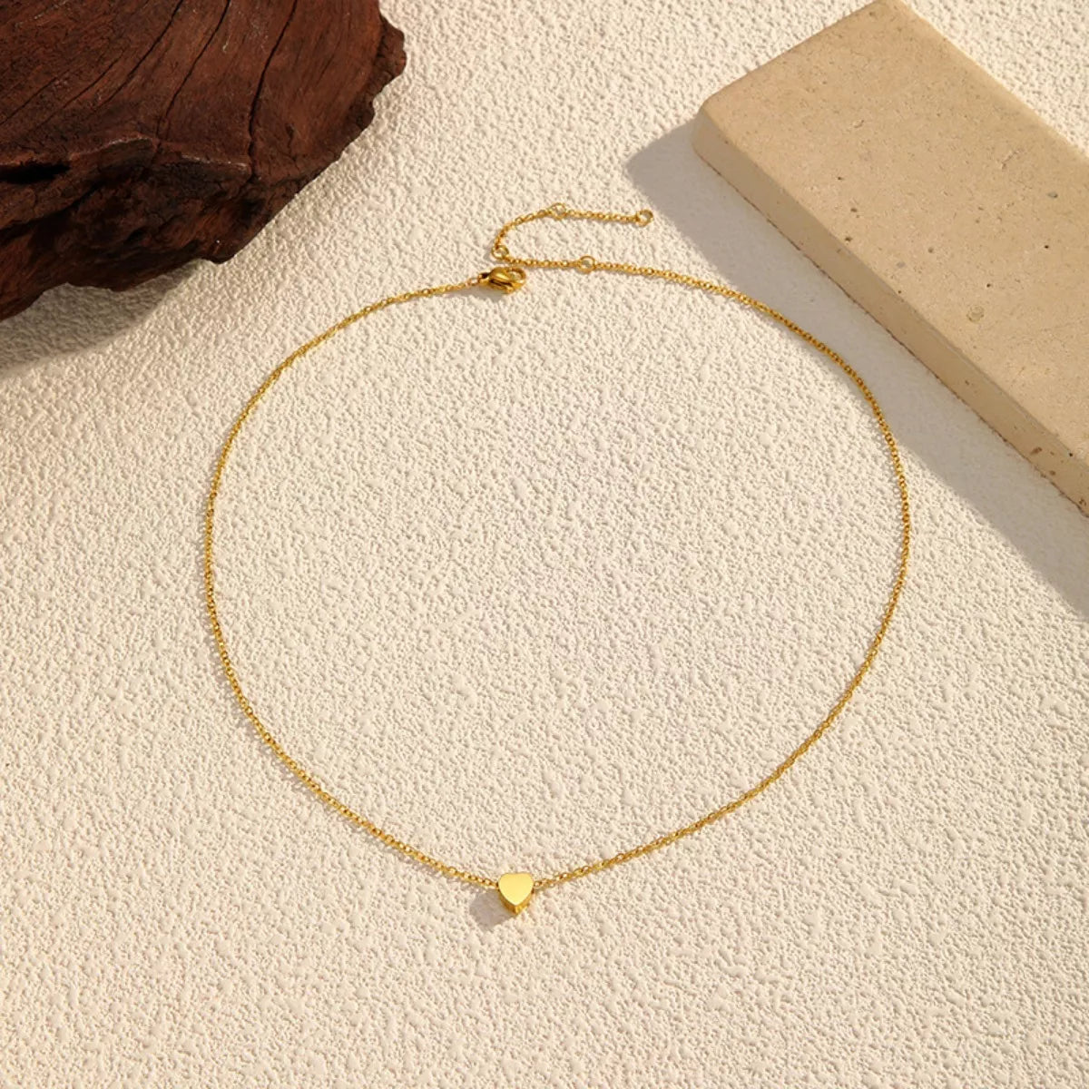 18K gold-plated heart pendant necklace with a delicate chain, showcasing a shiny, elegant jewelry piece from Shopimist.