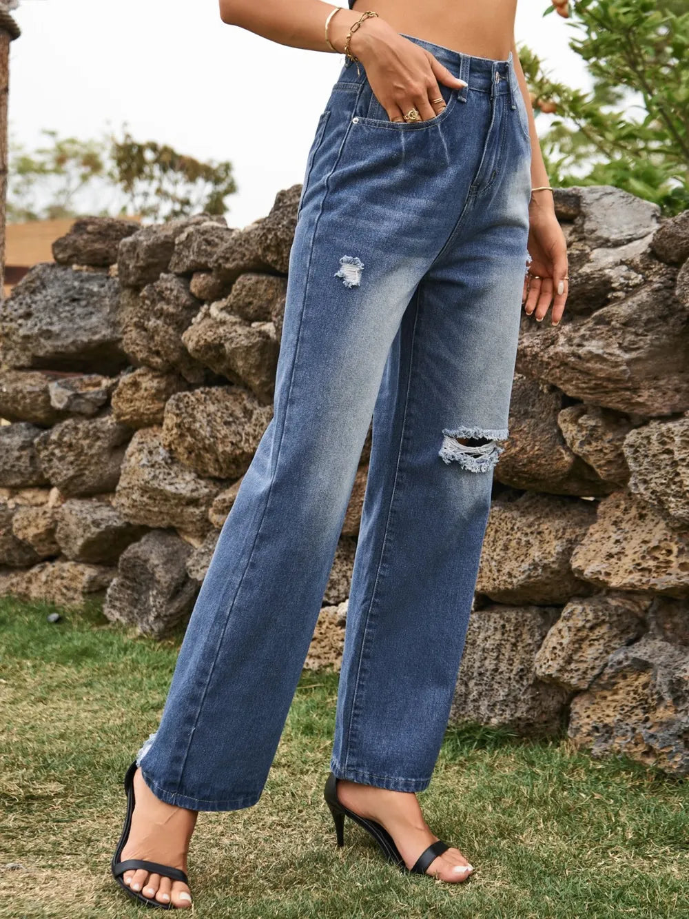 Distressed Plush Fashion Shop denim jeans with ripped details and front pockets, casual and stylish for everyday wear.