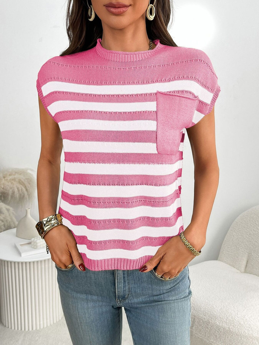 Women’s striped knit cap sleeve sweater with pocket detail, featuring a cozy outerwear design in a stylish pattern.