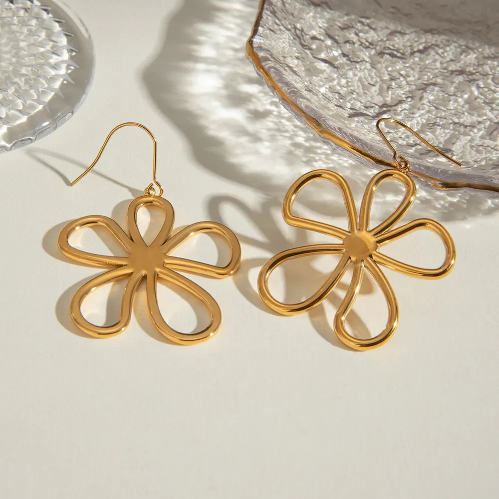 Gold-plated flower earrings from Plush Fashion Hub, featuring delicate floral design and shiny 18K gold finish.