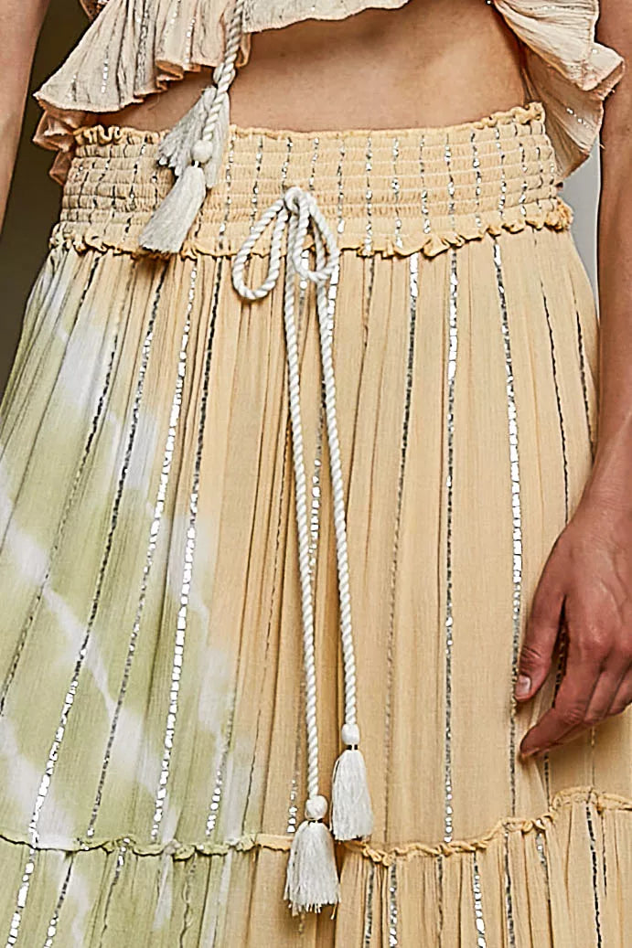 Shopimist POL shimmer tiered ruffle maxi skirt with smocked waist, featuring a flowing, layered design and shimmering fabric.