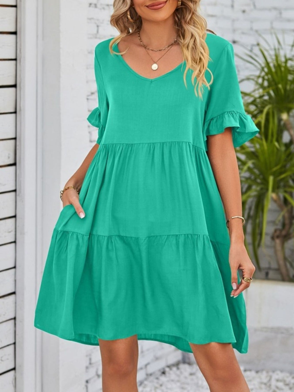 Lightweight rayon ruffled sleeve tiered mini dress with pockets, stylish and comfortable, by Trendsi.