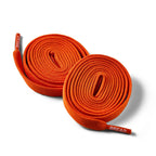 Coral orange elastic shoelace by Plush Fashion Hub, close-up view showing flexible, stretchable design for shoes.