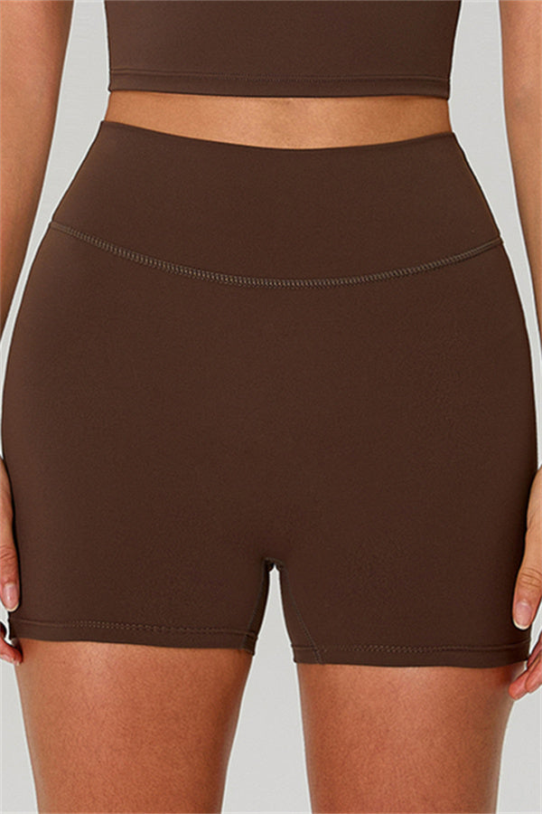 Fitglutes activewear one-shoulder crop top and matching shorts 2-piece gymwear set, black athletic sportswear for workouts.