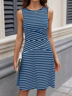 Shopimist round neck sleeveless dress with a fitted bodice and flowing skirt, displayed on a mannequin against a neutral background.