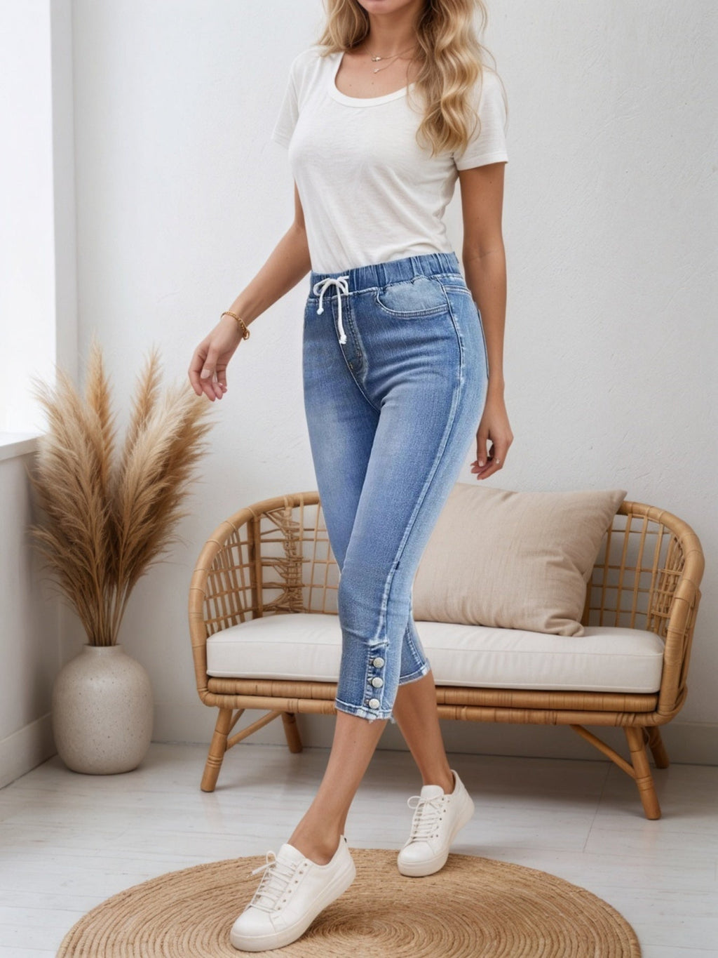 Women’s casual denim shorts with drawstring waist from FitiqueFit, shown on a model, featuring a relaxed fit and classic blue denim.