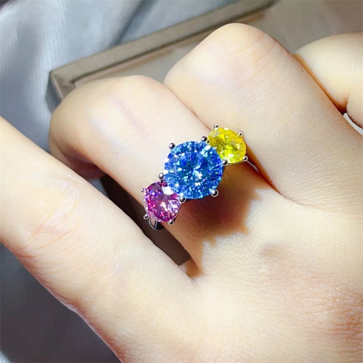 Sterling silver ring with a 5-carat moissanite gemstone, featuring intricate detailing and a polished finish.