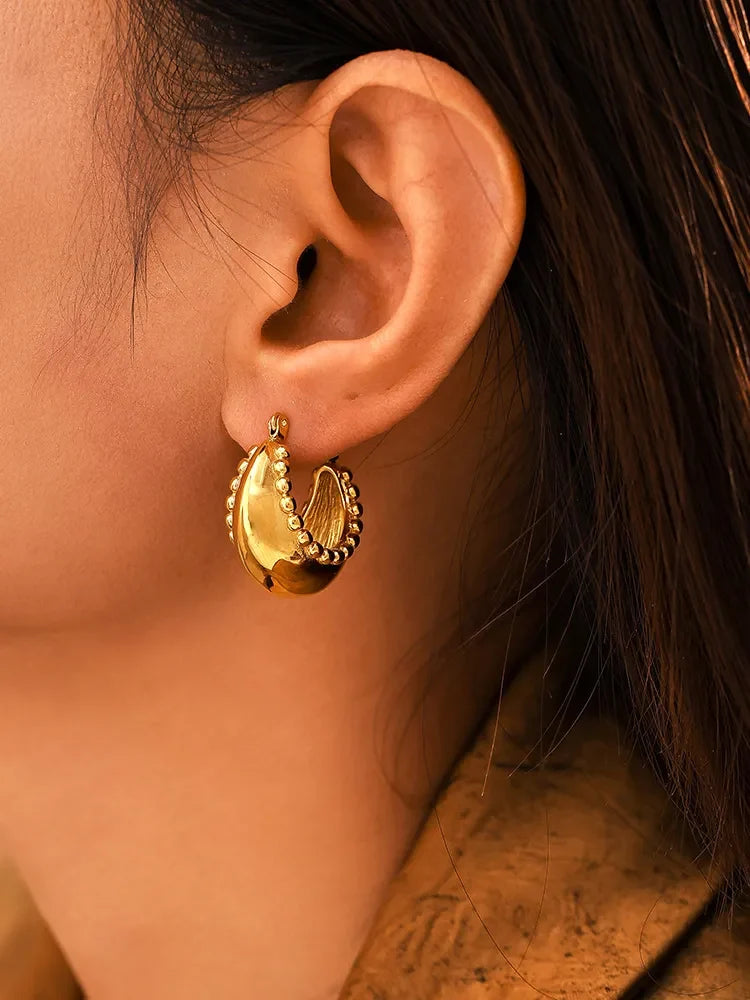 18K gold-plated stainless steel huggie earrings with a sleek, minimalist design, perfect for everyday wear.