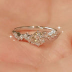 Sterling silver moissanite ring with 2 carats, featuring a sparkling center stone and intricate band design.