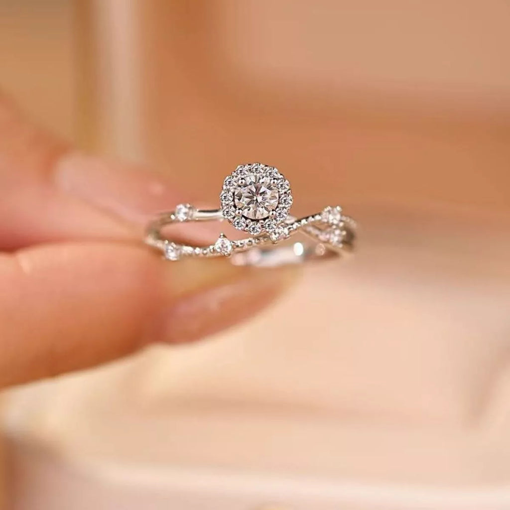 Sterling silver layered ring with 1 carat moissanite gemstone, featuring elegant design and sparkling brilliance.