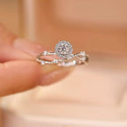 Sterling silver layered ring with 1 carat moissanite gemstone, featuring elegant design and sparkling brilliance.